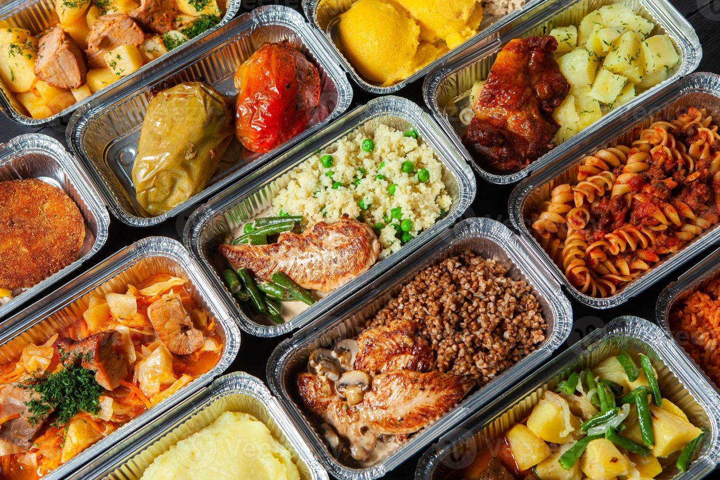 Business lunch in eco plastic container ready for delivery.Top view. Office Lunch boxes with food ready to go. Food takes away. Catering, brakfast. photo