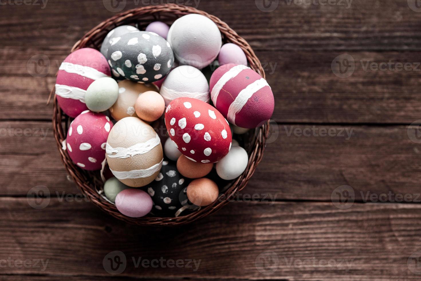 Hand painted pastel colored Easter eggs background. Happy Easter greeting card or invitation. photo