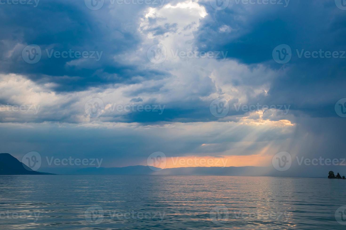 Fantastic evening panorama of the lake with clouds on sunrise, Switzerland. Picturesque autumn sunrise in Swiss alps, Grindelwald, Bernese Oberland, Europe. The beauty of nature concept background. photo