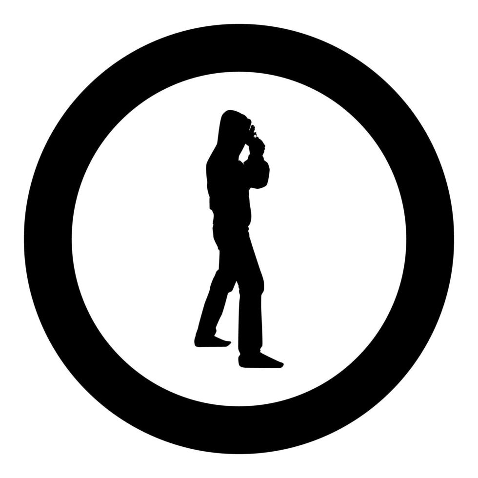 Man in the hood with gun Concept danger short arm near head icon black color illustration in circle round vector