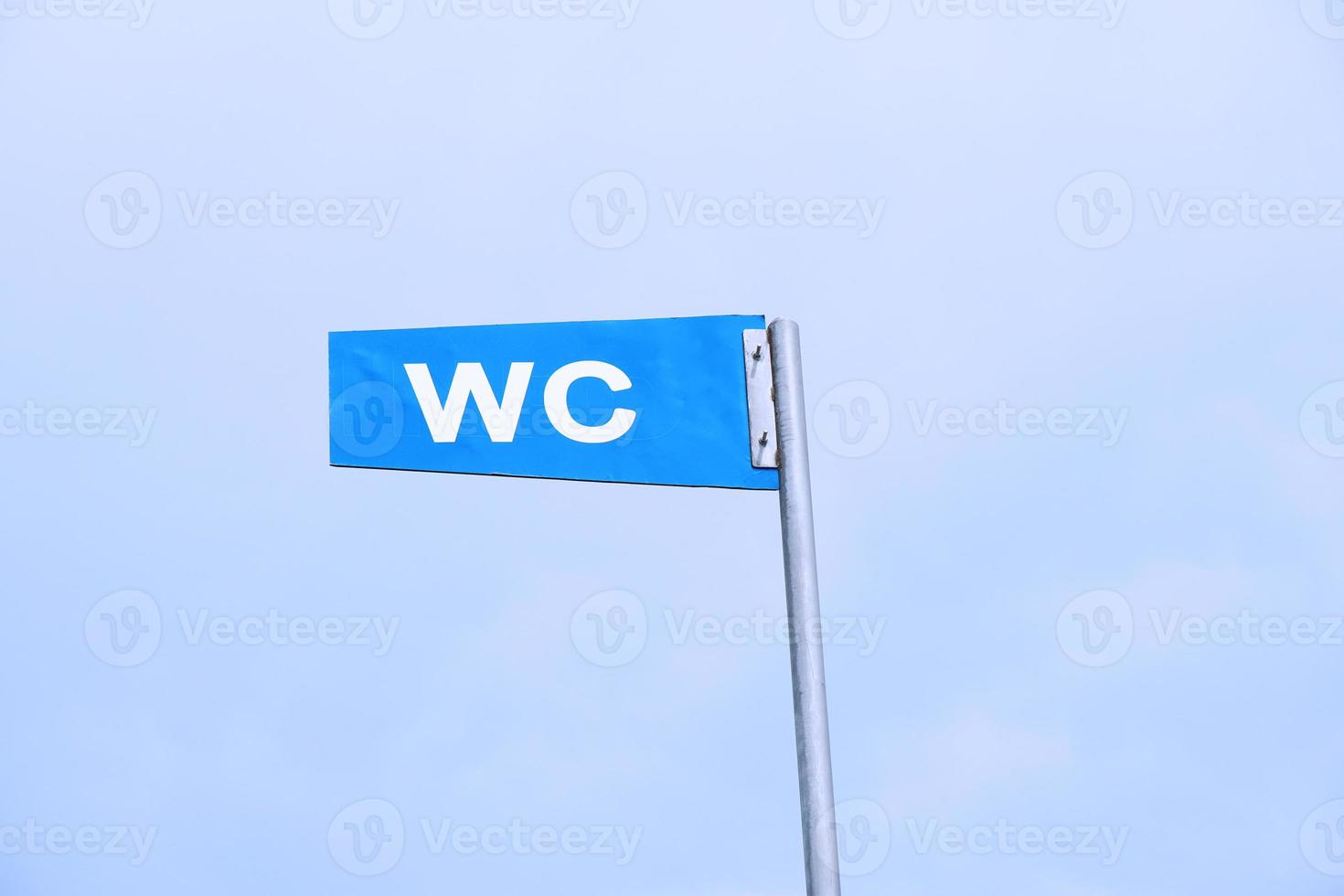 WC sign against sky photo