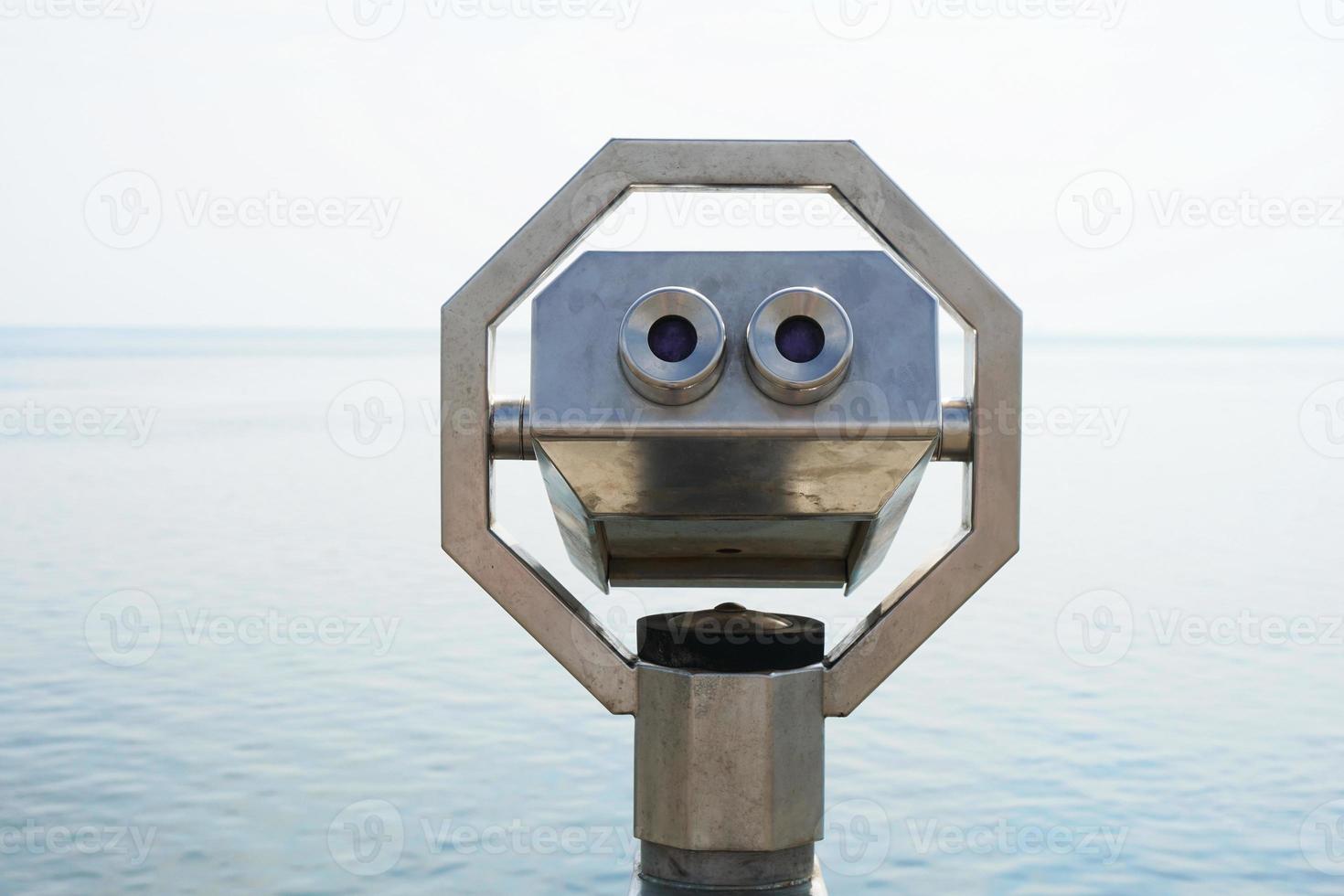 seaside overlook with coin-operated binoculars photo