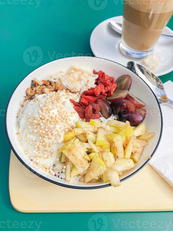 healthy breakfast bowl with fresh fruit and coffee photo