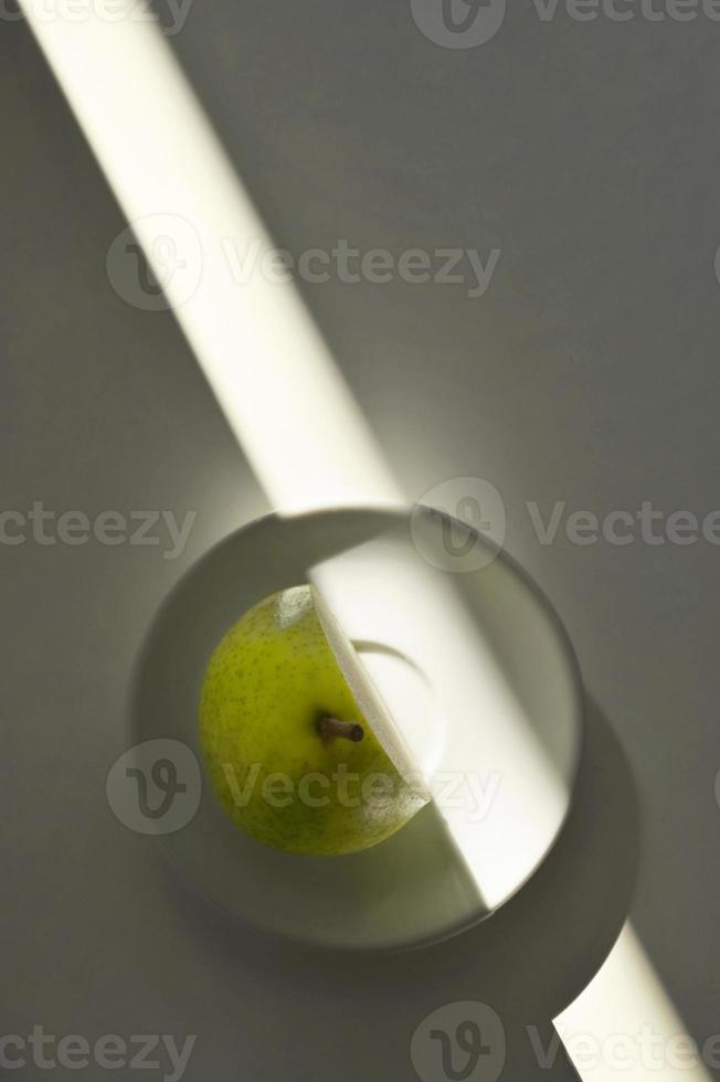 Abstract Ripe Pear With Cut from Sunrays photo