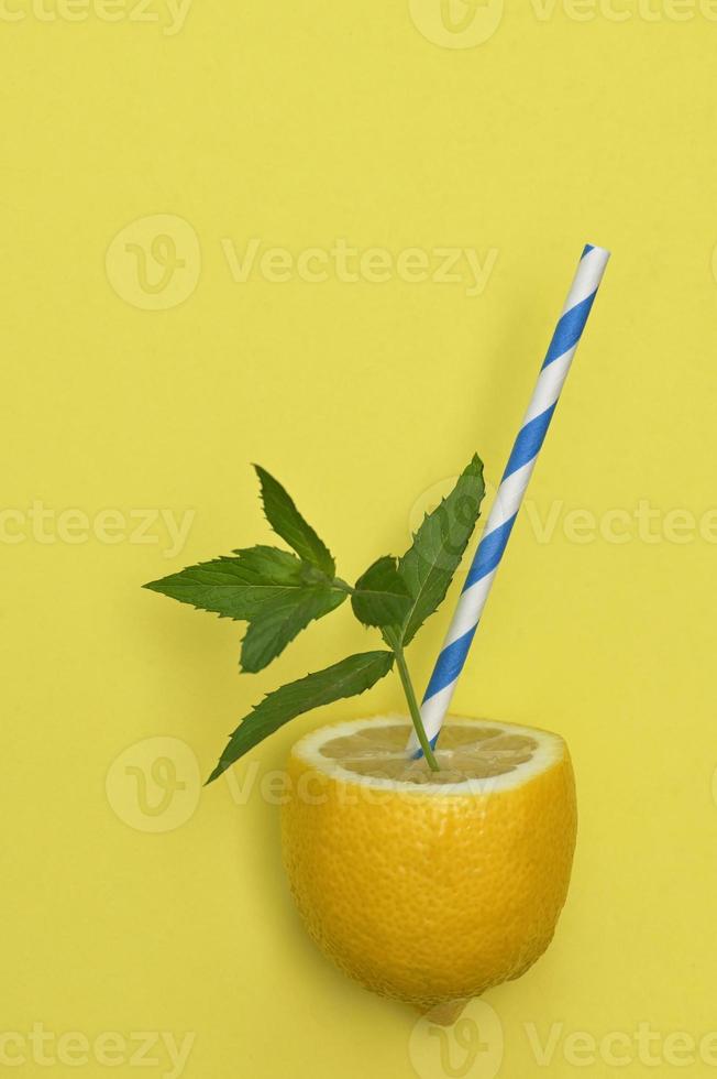 Lemonade from Lemon Fruit, Straw and Mint Leaves photo