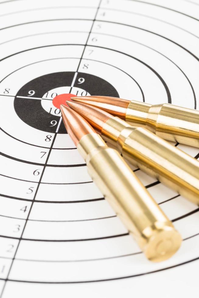 Rifle bullet over target background photo