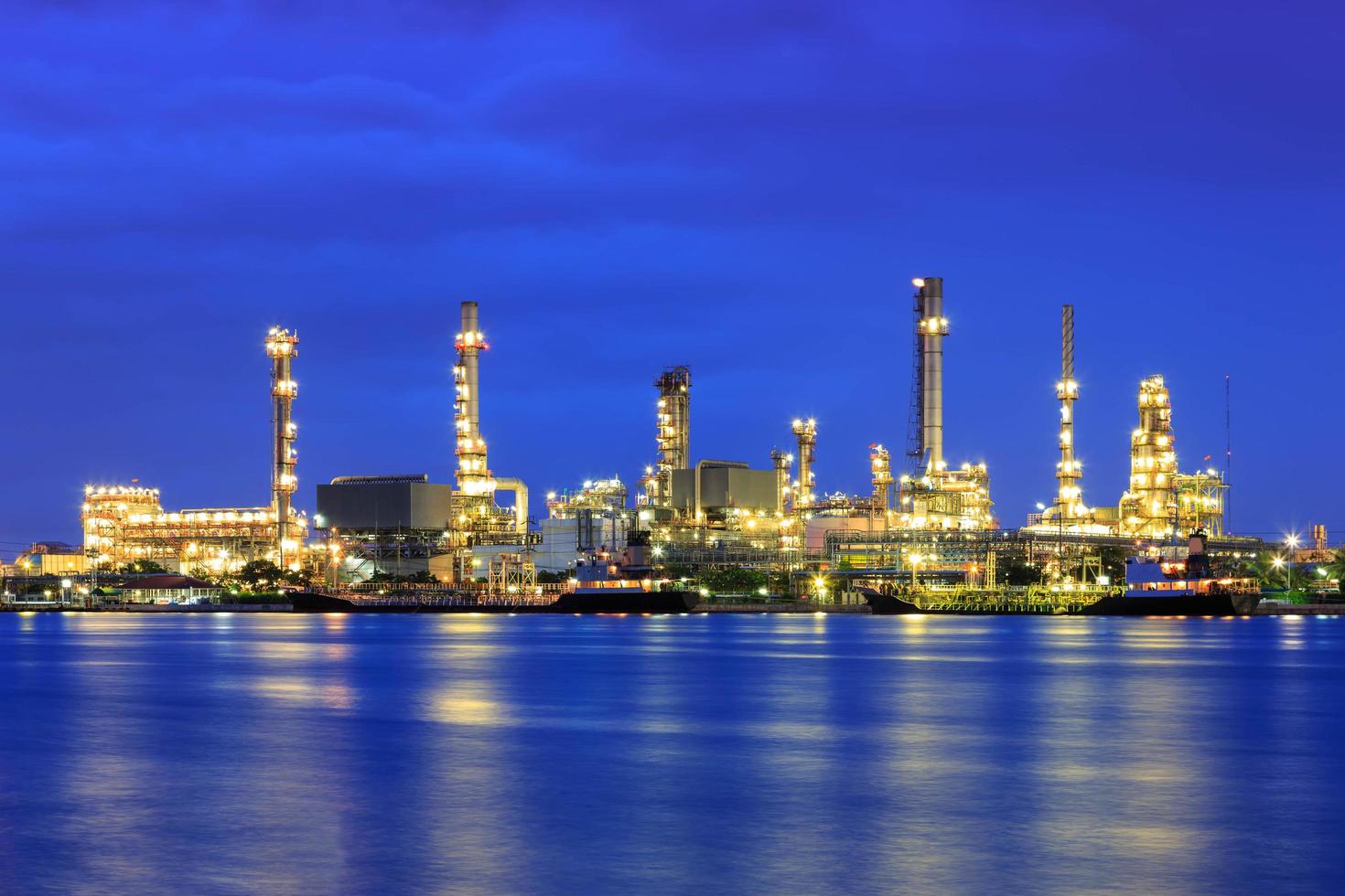 Oil refinery at twilight with reflection photo