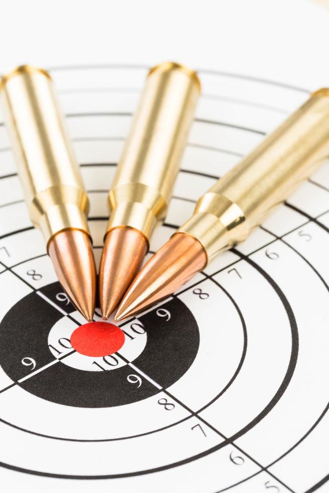 Rifle bullet over target background photo