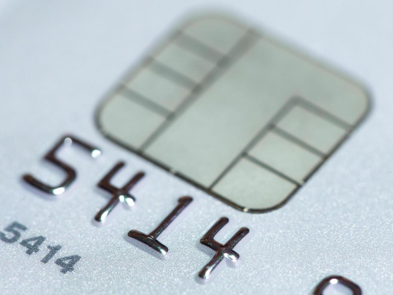 White credit card with micro chip selective focus photo