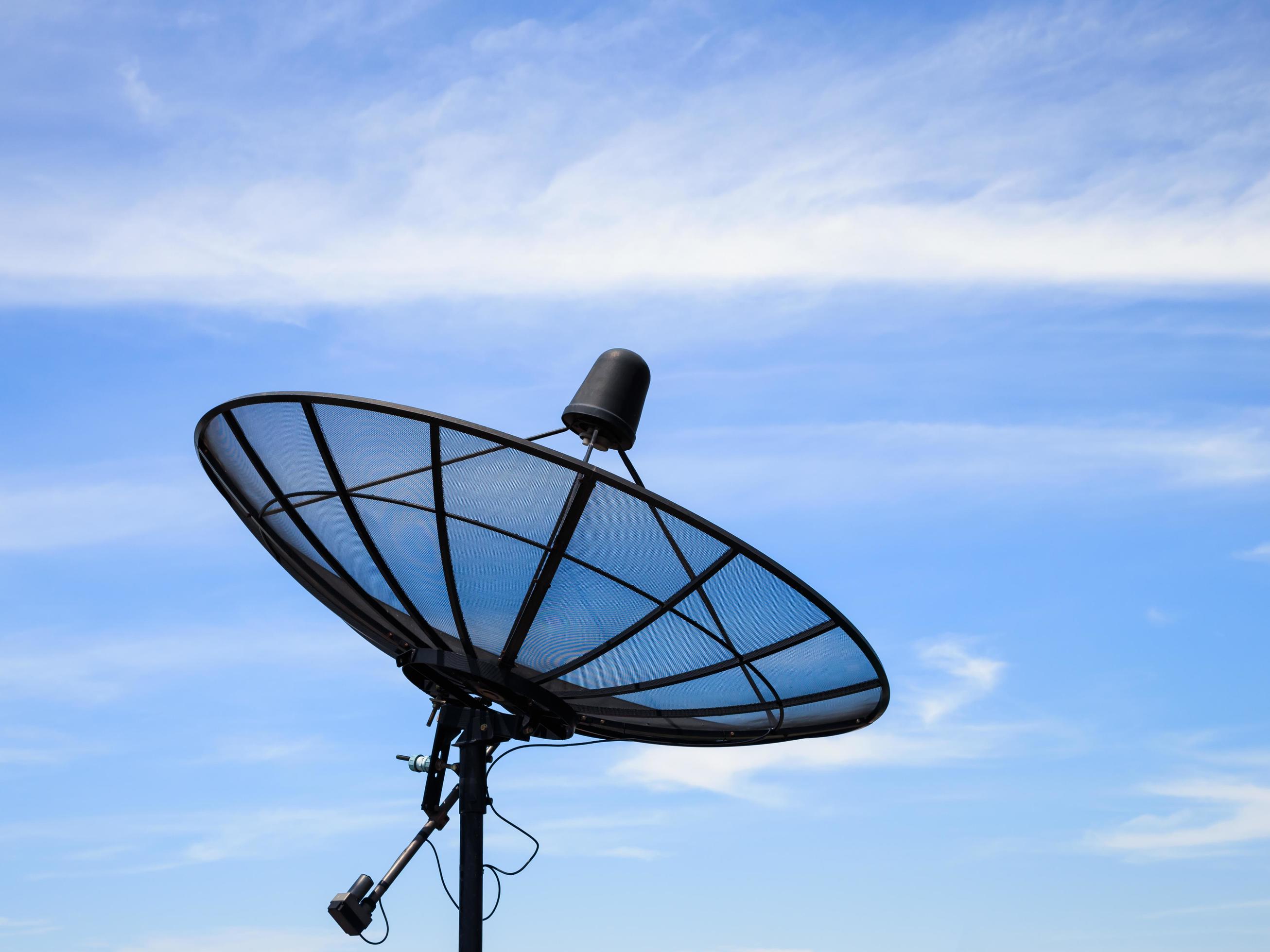 Home satellite dish receiver with blue sky 7039409 Stock Photo at Vecteezy