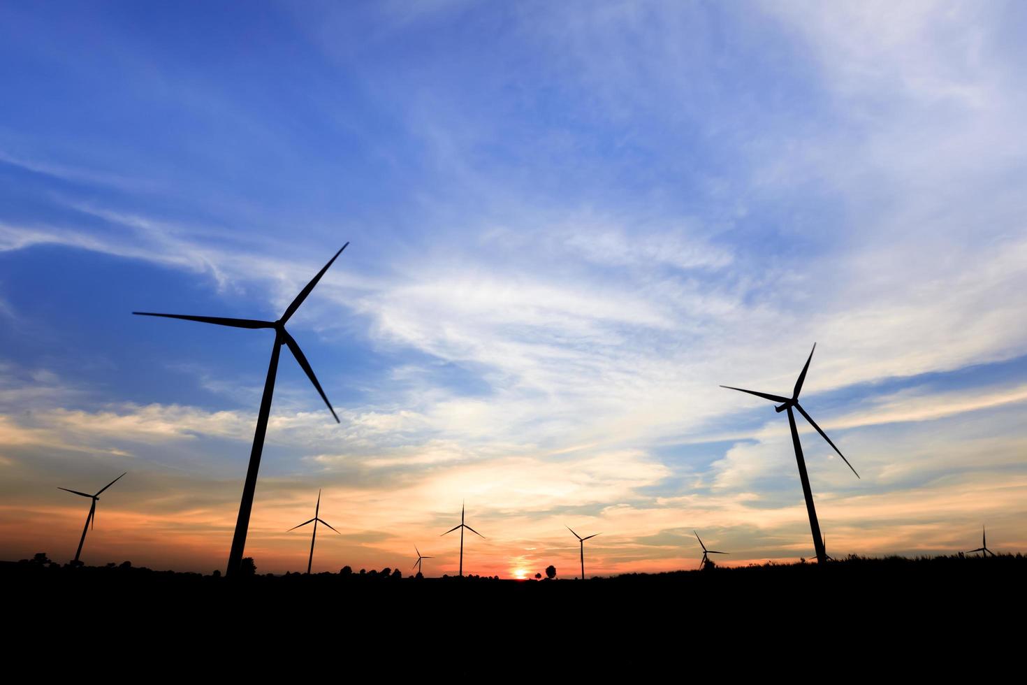 Wind turbine power generator at twilight photo