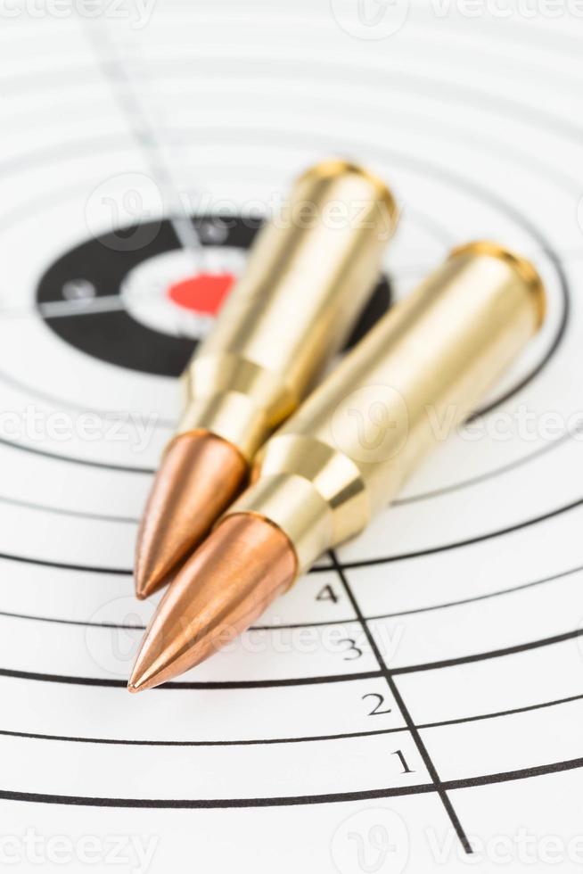 Rifle bullet over target background photo