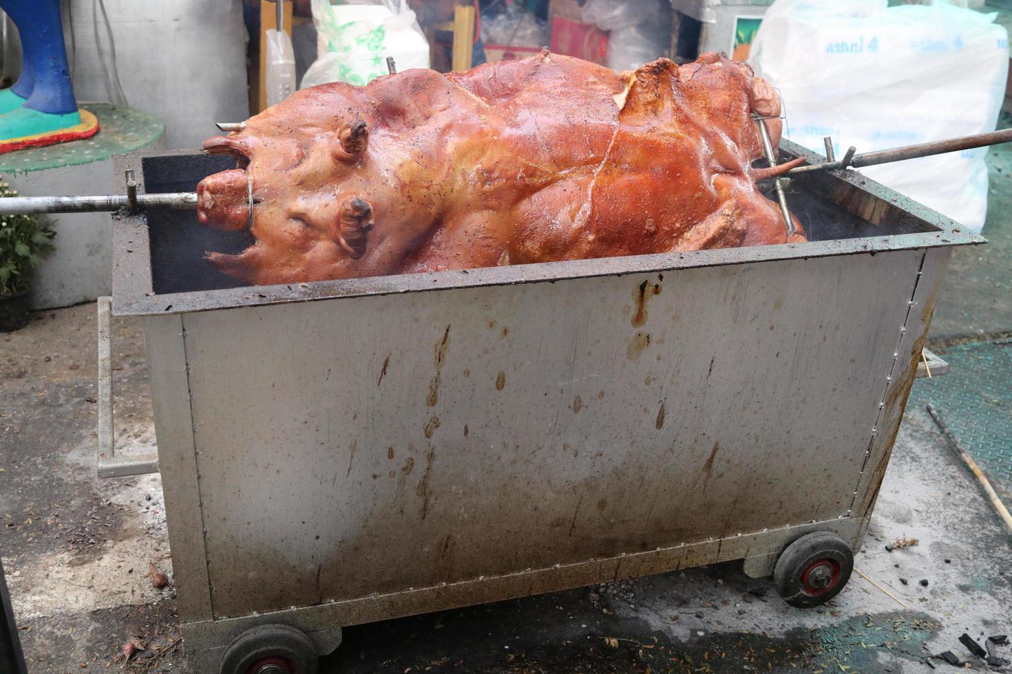 Whole pig grilling on stove. photo