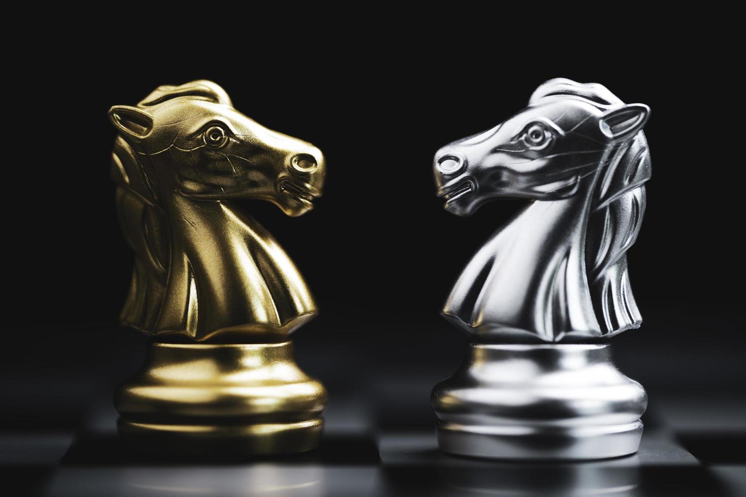 Closeup golden and silver knight encounter for fighting or business competition concept. photo
