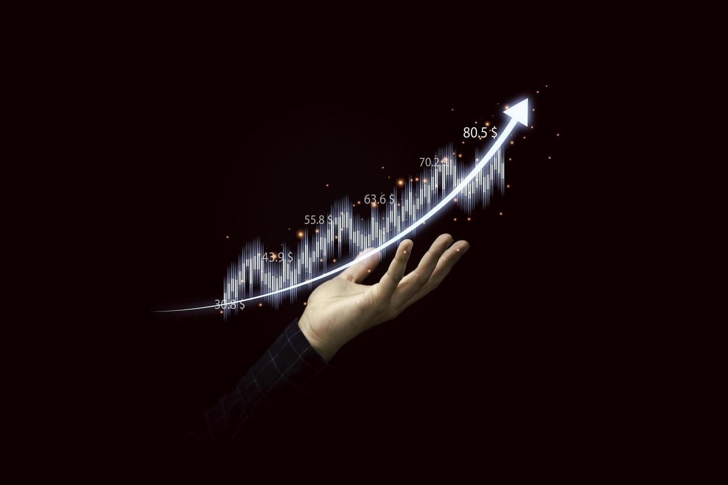 Trader holding graph chart with arrow for analysis stock market information , Investment concept. photo