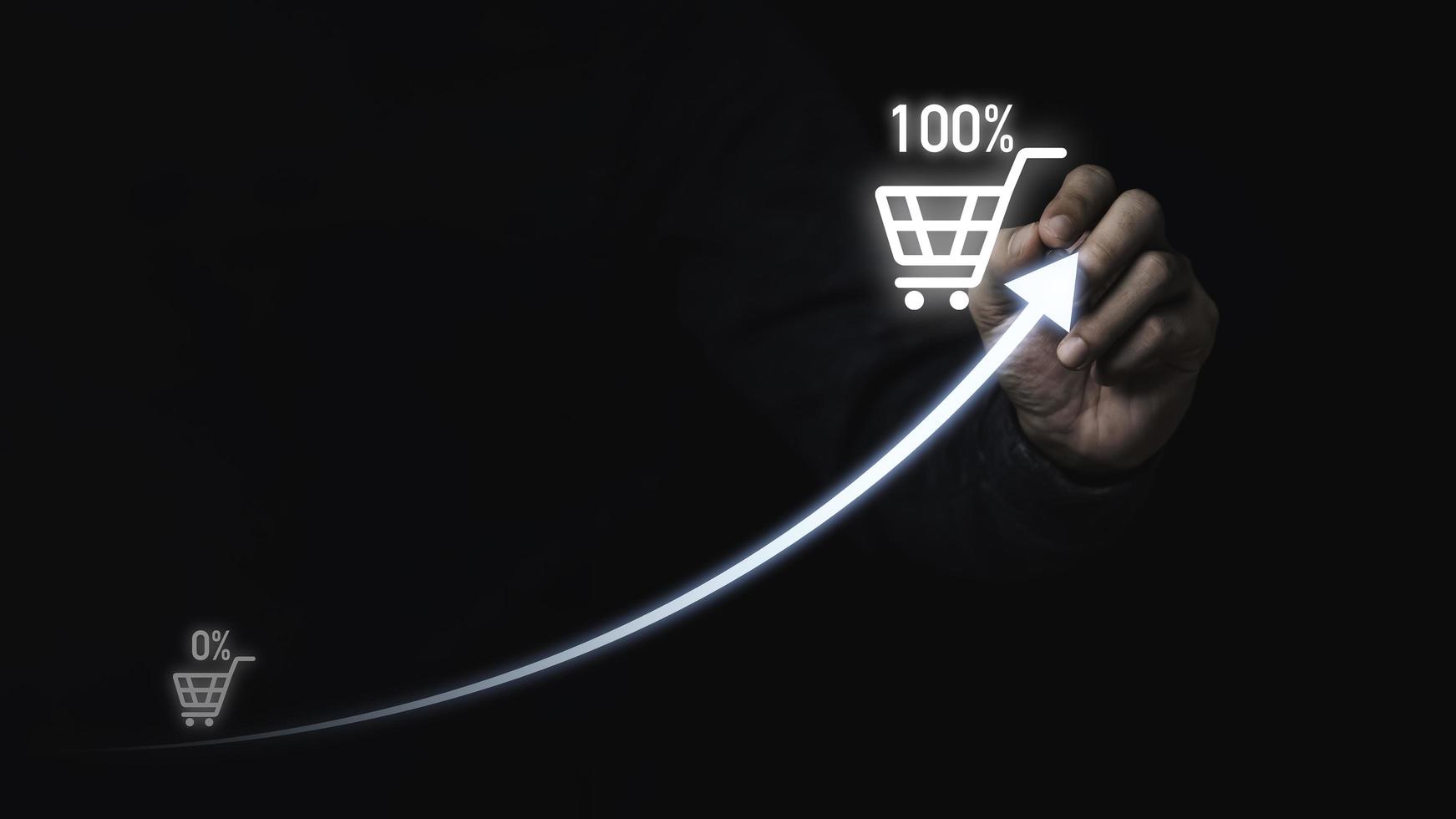 Businessman hand drawing increasing arrow and shopping trolley cart for sale business and shopping growth concept. photo