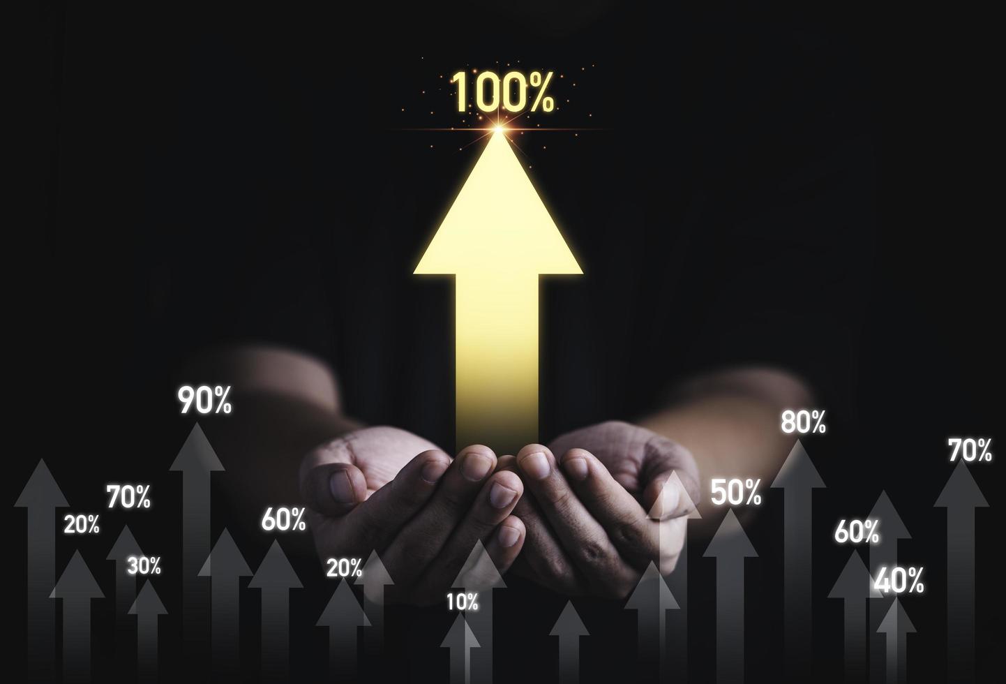 Man hand holding golden increasing arrow with percentage for business profit development growth to success concept. photo