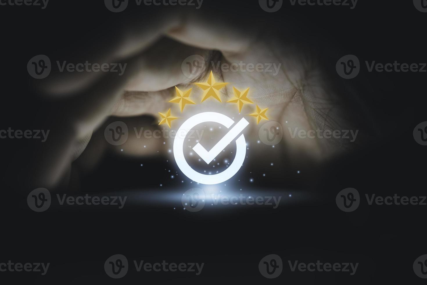 Hand protecting and showing the best quality assurance with golden five stars for guarantee product and ISO service concept. photo