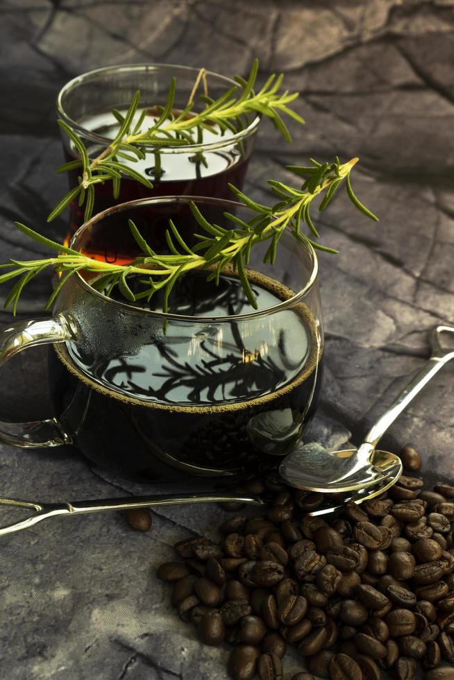 Hot black coffee and hot tea on dark stone background photo