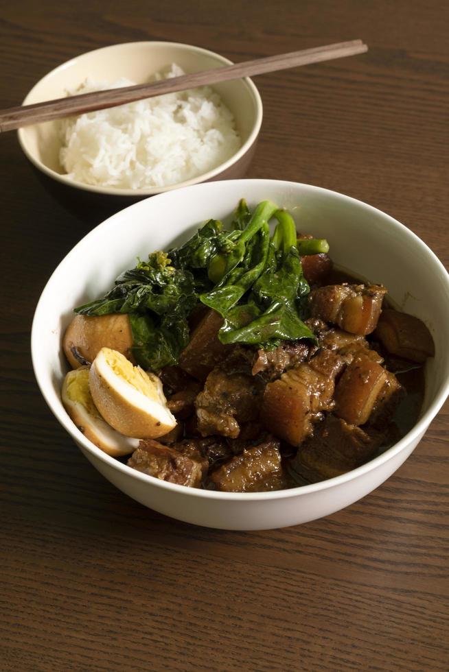 Chinese style braised pork belly with steamed rice photo