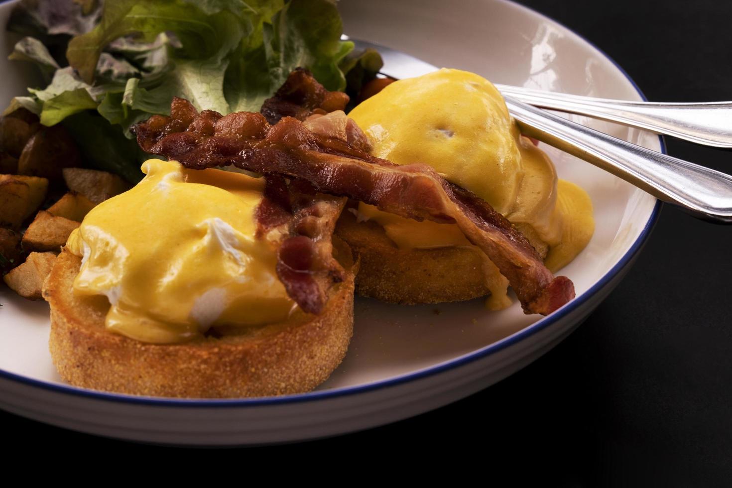 Eggs Benedict Bacon Breakfast on the Table photo