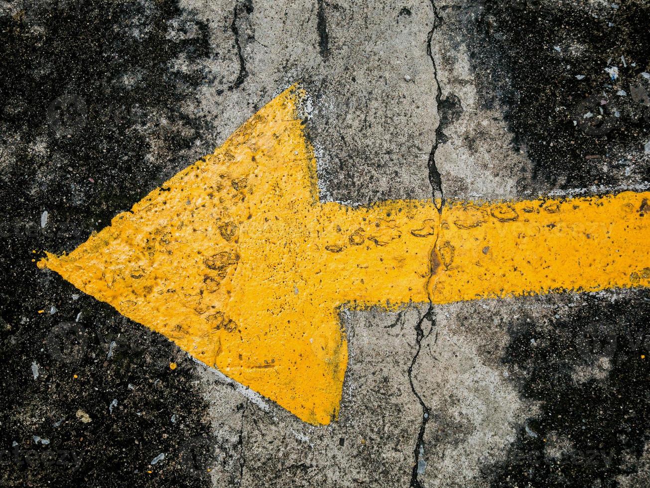 traffic direction arrow on the road photo