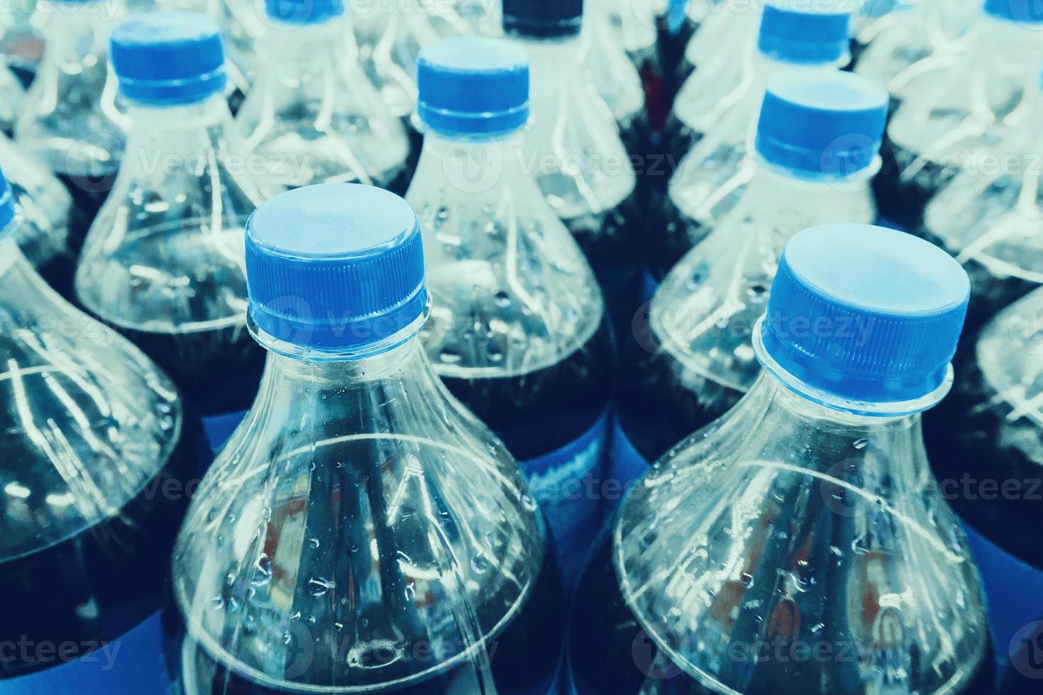 Carbonated soft drink bottles close up photo