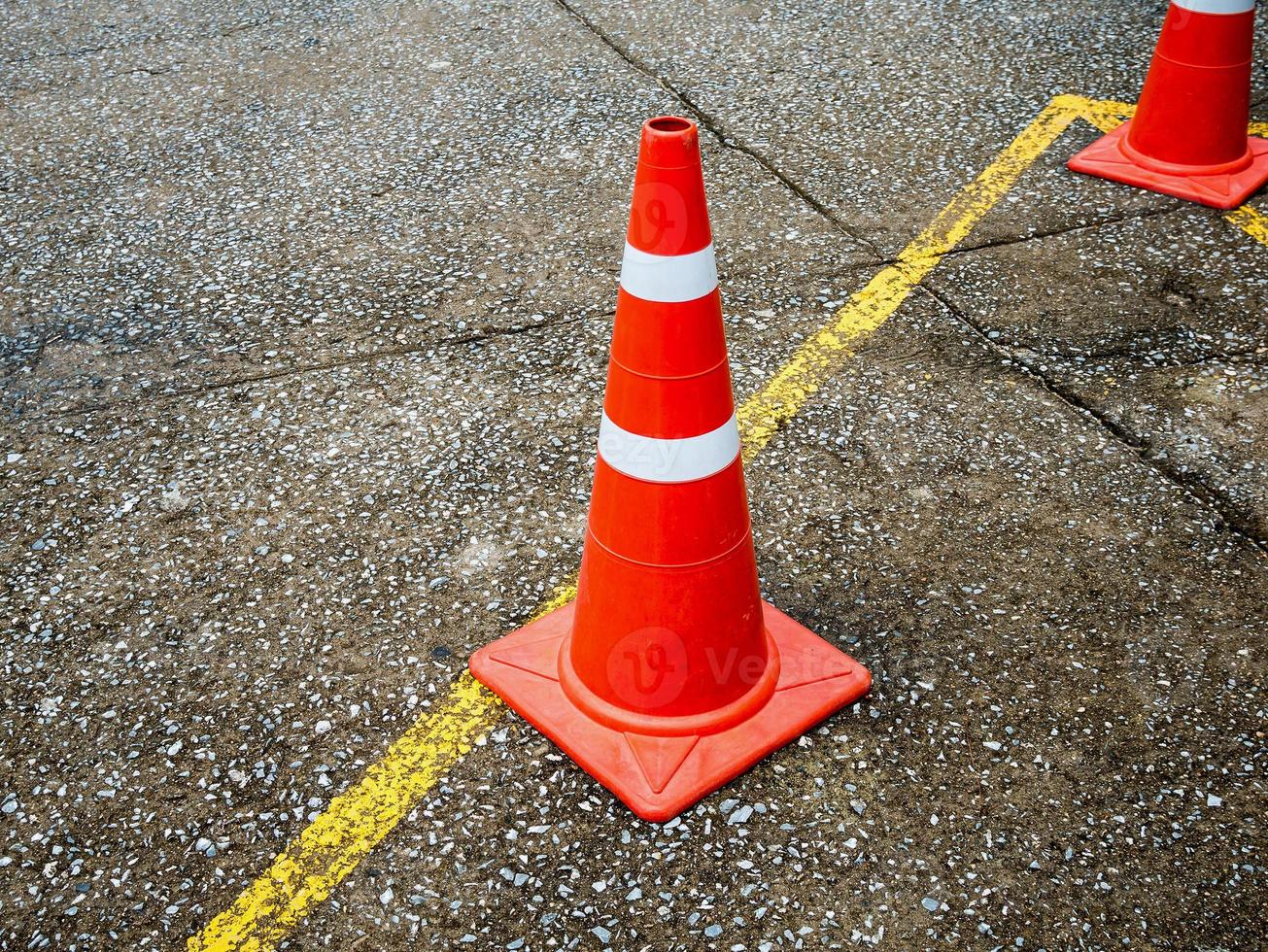 Traffic cone on the asphalt road photo