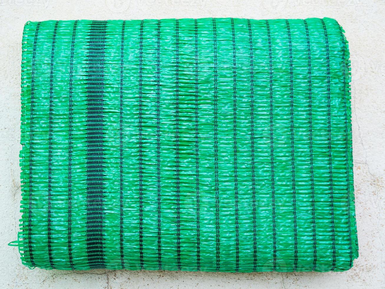 Green Shading Net on the floor ready to install photo
