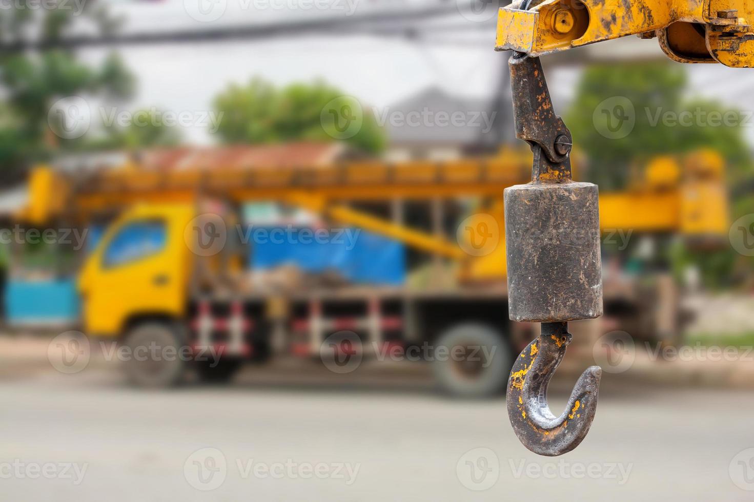 cranes hooks hanging over crane truck background photo