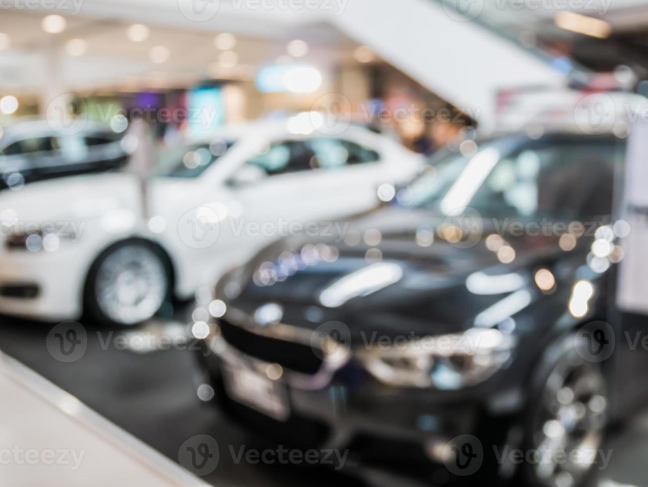 car showroom with new cars blur background photo