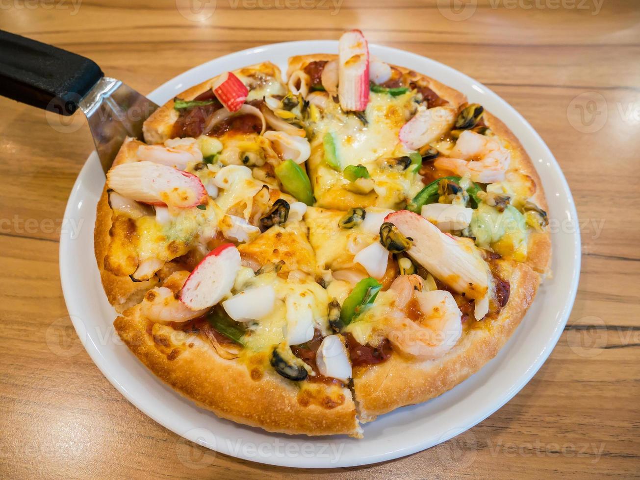 delicious pizza with seafood photo