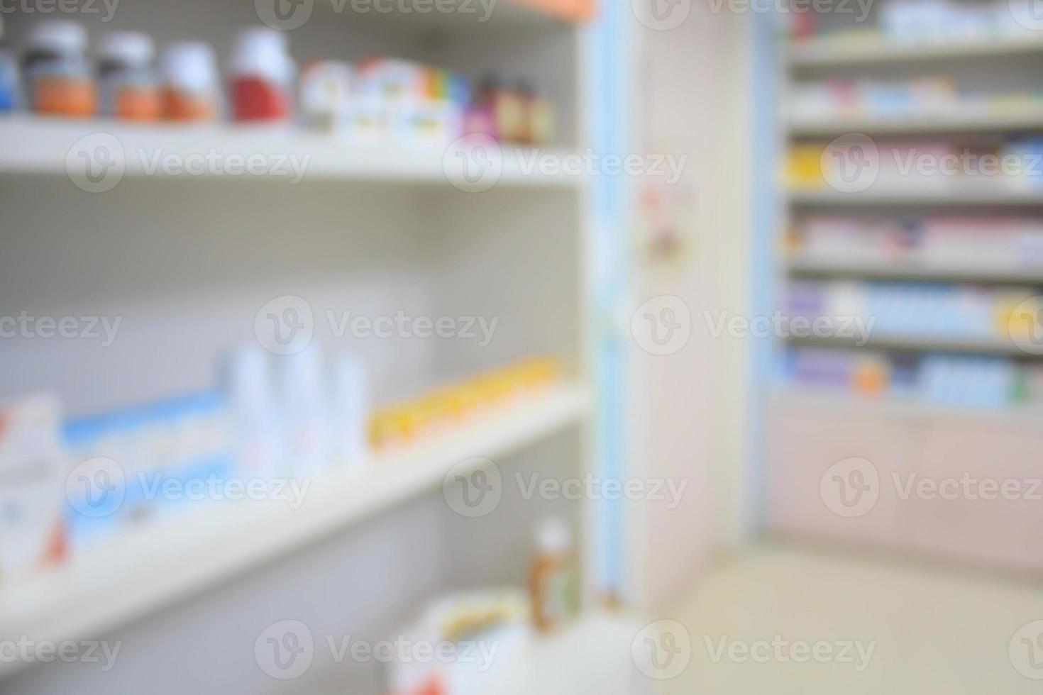 blur shelves of drugs in the pharmacy shop photo