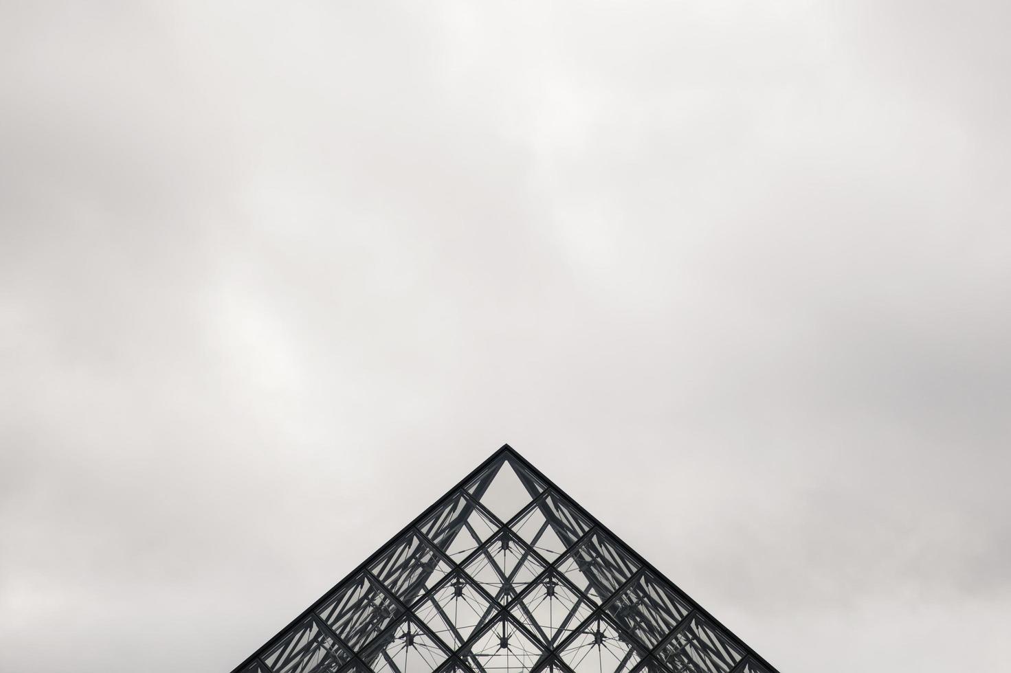 Paris, France, 2018 - View at Louvre Pyramid in Paris, France. Pyramid was completed in 1989 and become a landmark of the Paris photo