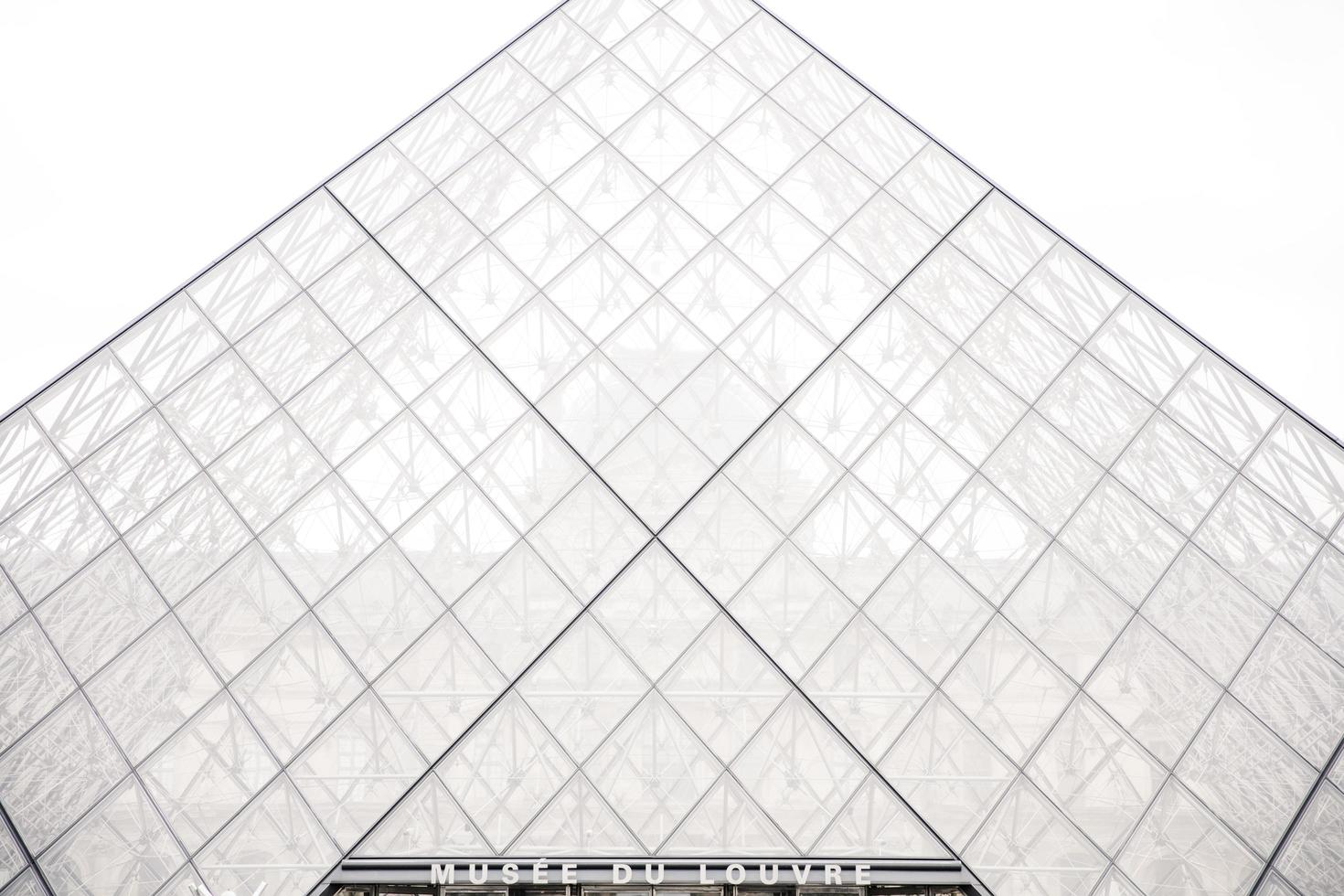 Paris, France, 2018 - View at Louvre Pyramid in Paris, France. Pyramid was completed in 1989 and become a landmark of the Paris photo