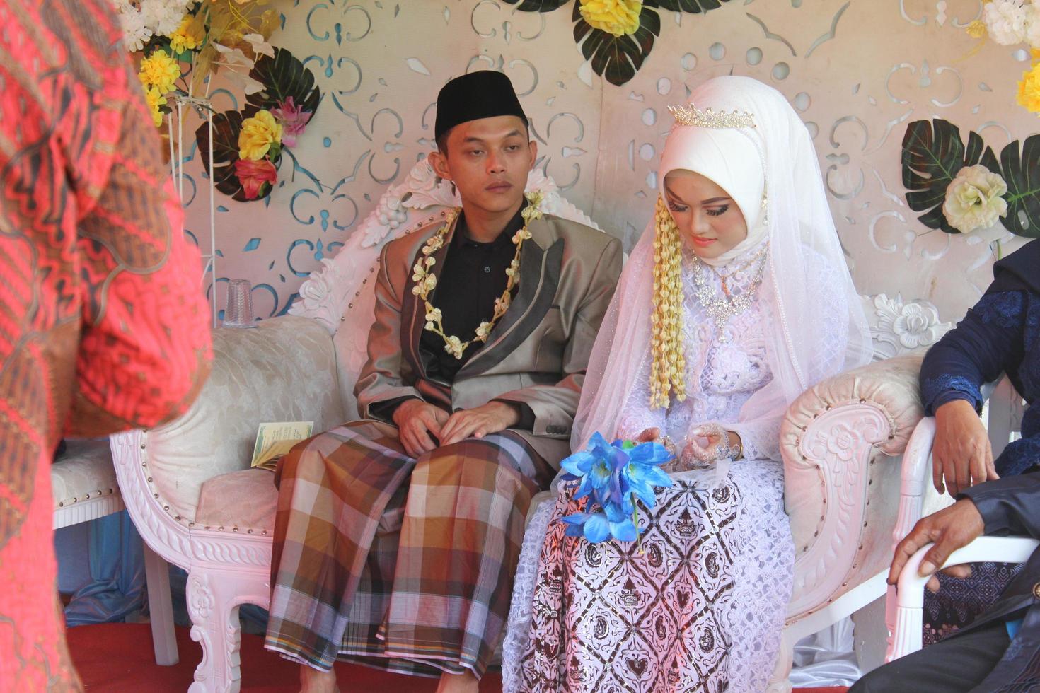 Cianjur Regency West Java Indonesia on June 12, 2021 - A happy couple.  Indonesian Muslim Wedding. photo