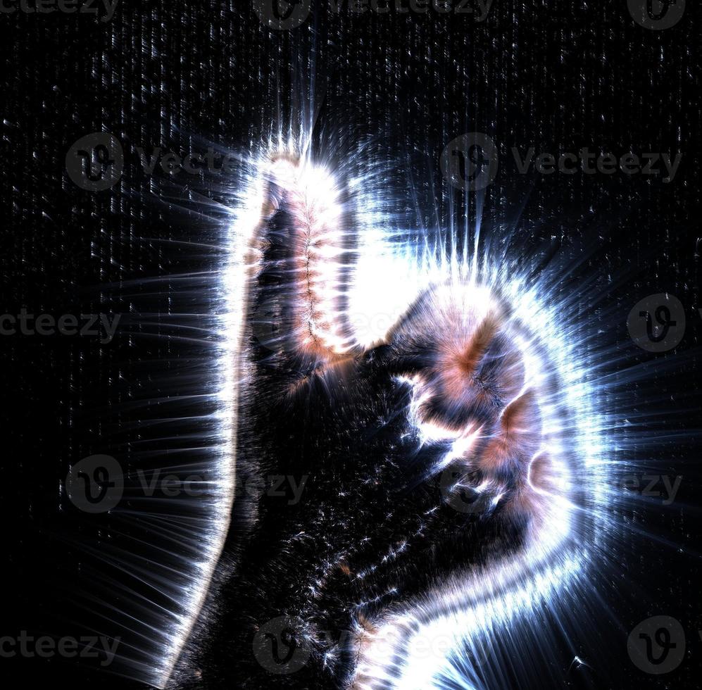 3D-Illustration of a glowing human female hand with a kirlian aura showing different symbols photo