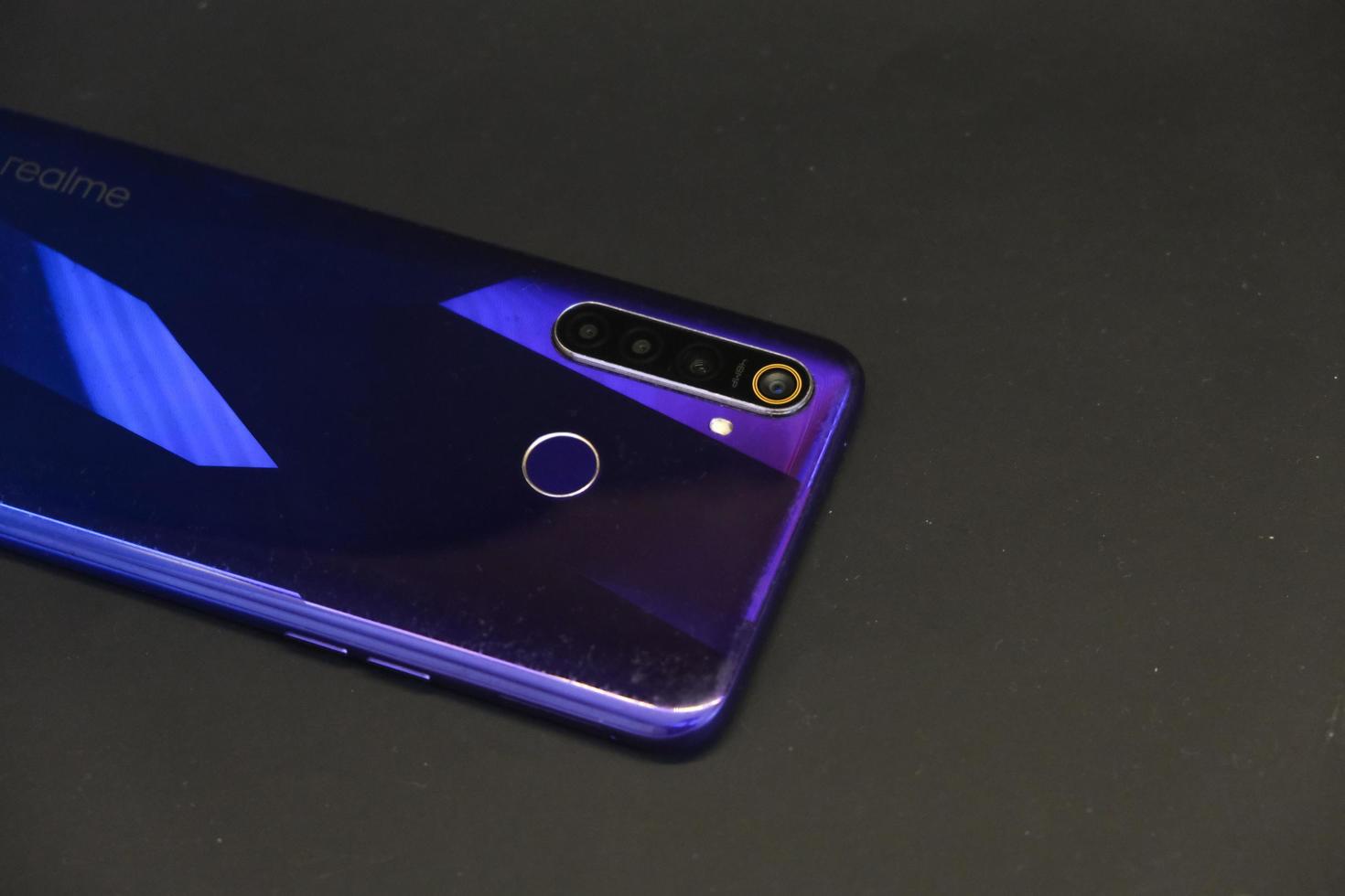 close up of a blue mobile phone, realme 5 pro photo