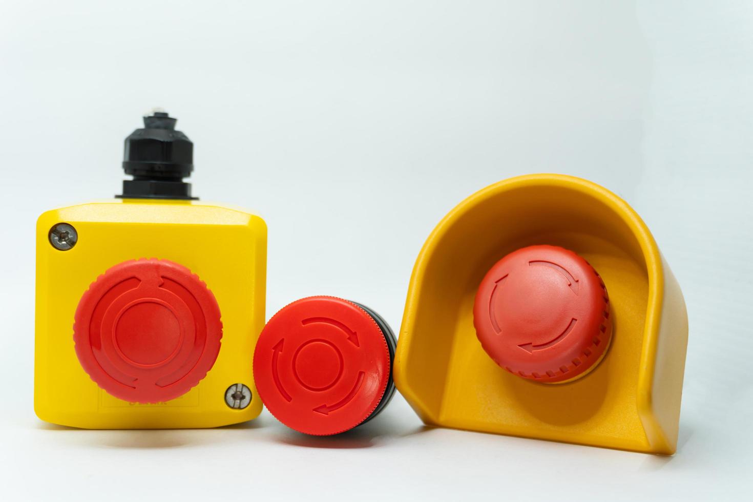 Stop Red Button and the Hand of Worker About to Press it. emergency stop button. Big Red emergency button or stop button for manual pressing. photo