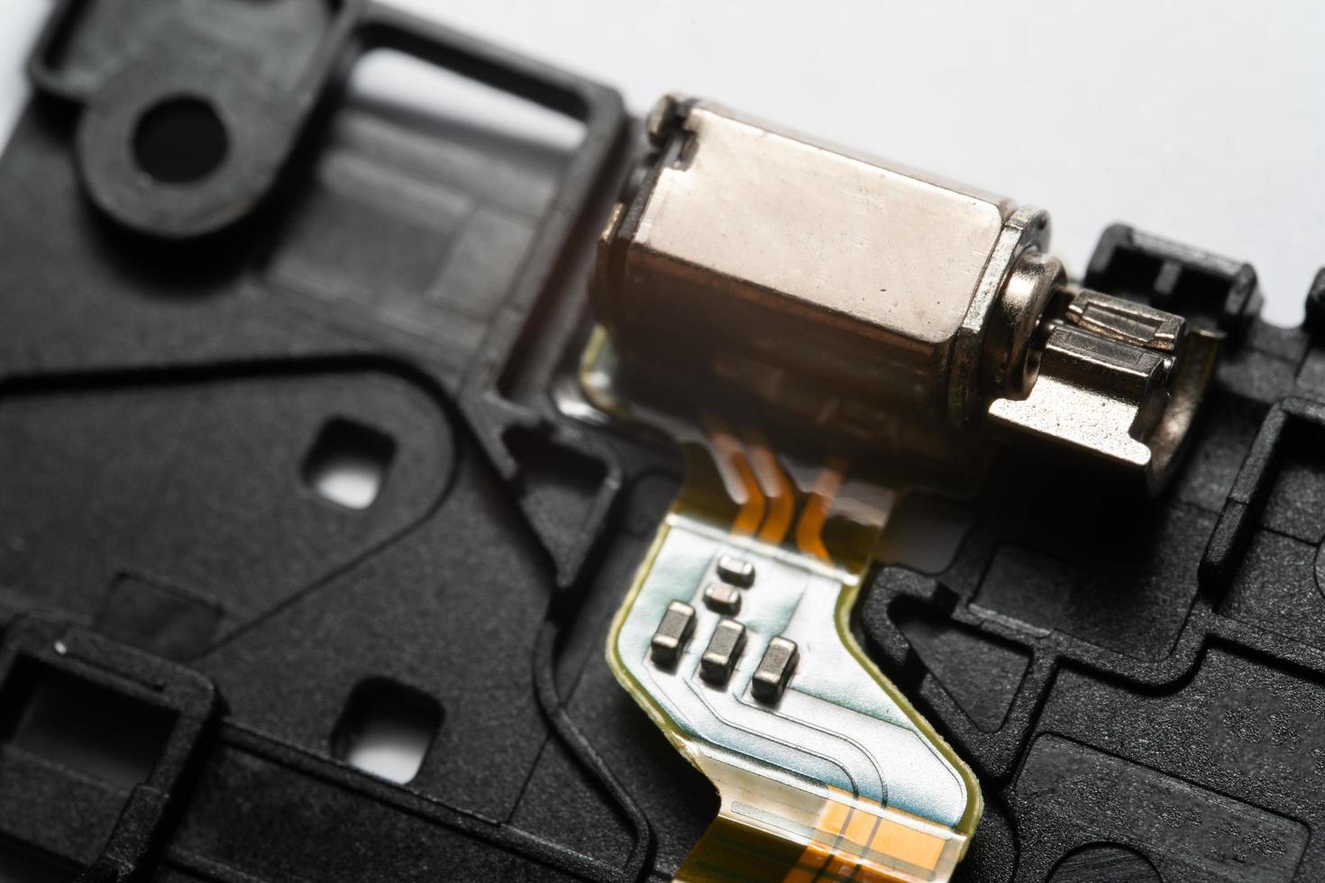 Motor that generates vibration to the mobile phone. photo