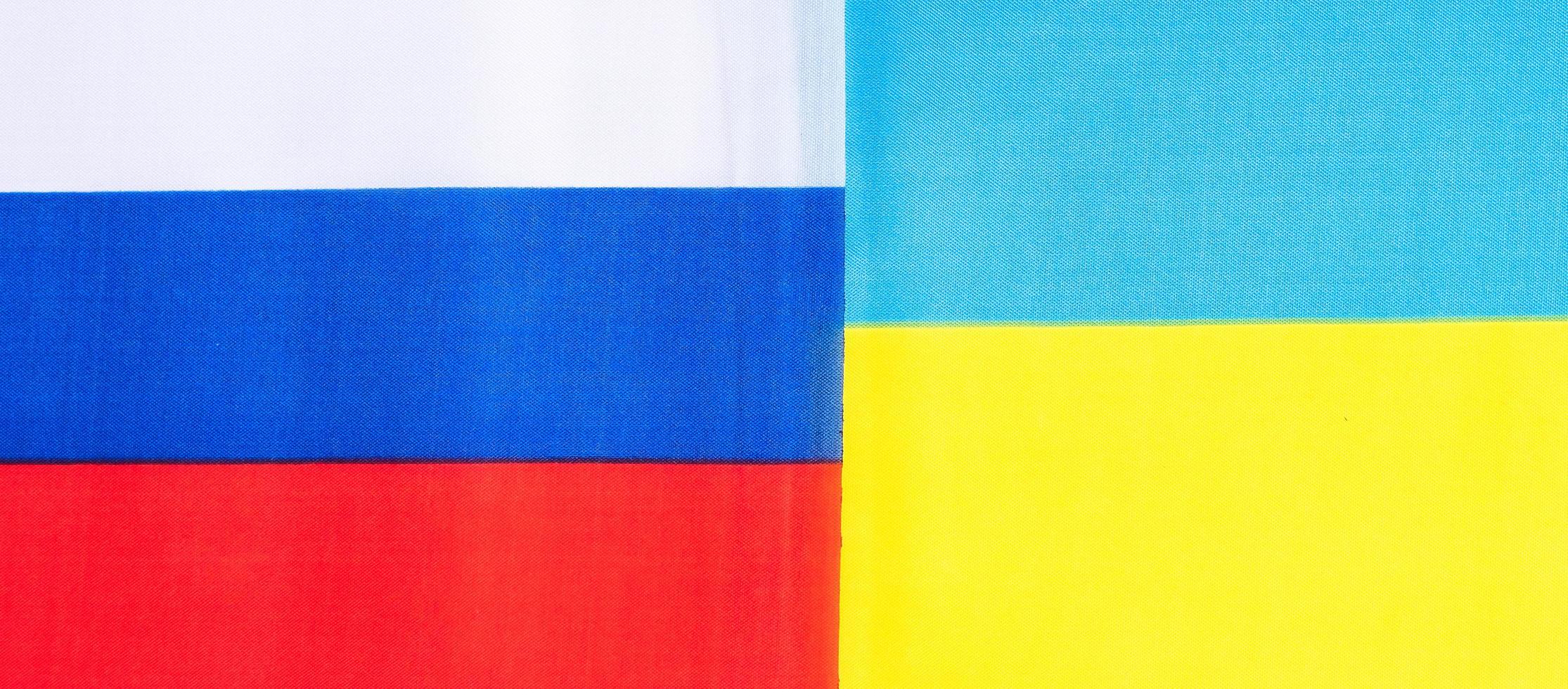 Ukraine. and Russia flags. Pray, No war, stop war, conflict and relationship concept photo