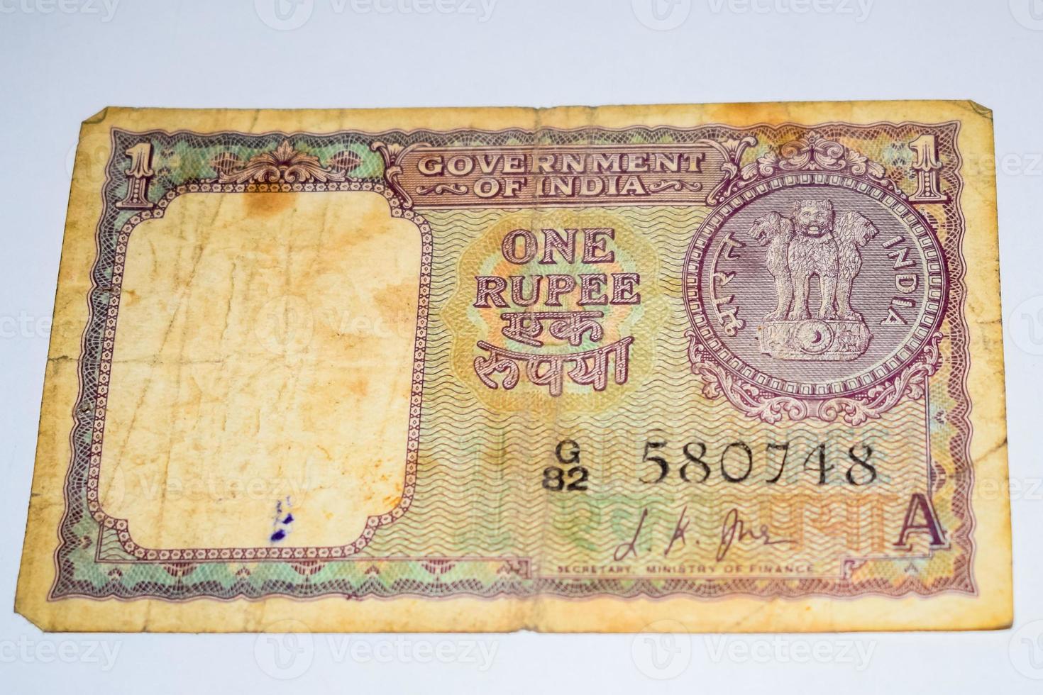 Rare Old Indian One rupee currency note on white background, Government of India one rupee old banknote Indian currency, Old Indian Currency note on the table photo