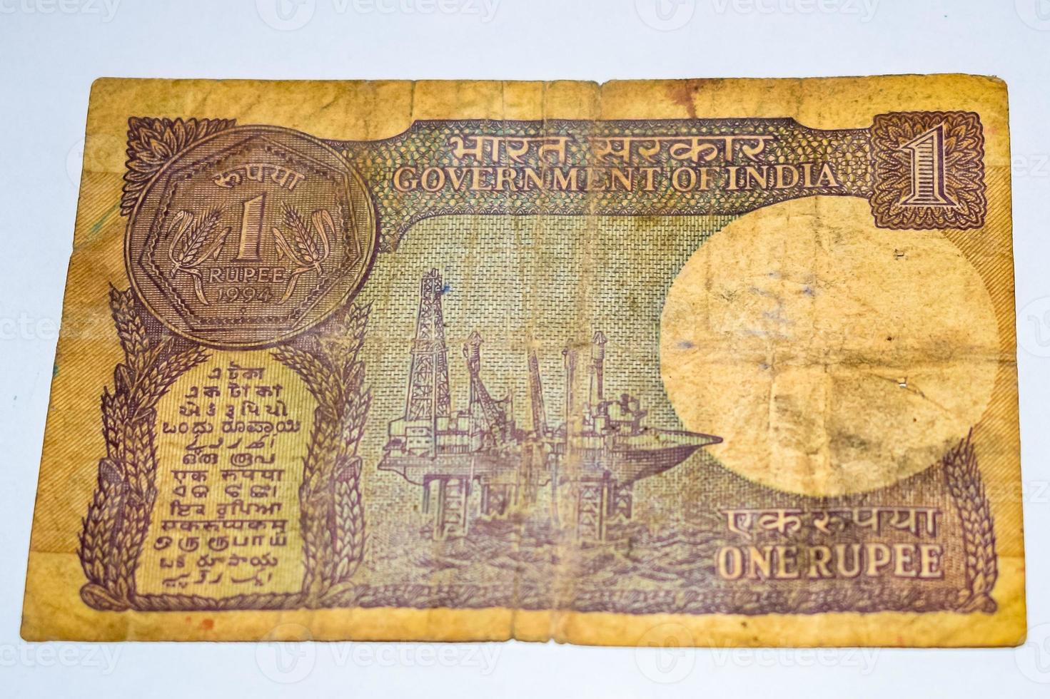 Rare Old Indian One rupee currency note on white background, Government of India one rupee old banknote Indian currency, Old Indian Currency note on the table photo
