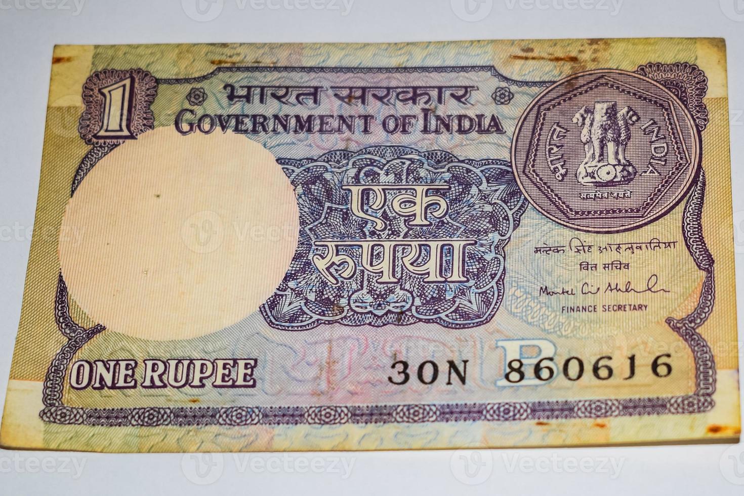 Rare Old Indian One rupee currency note on white background, Government of India one rupee old banknote Indian currency, Old Indian Currency note on the table photo