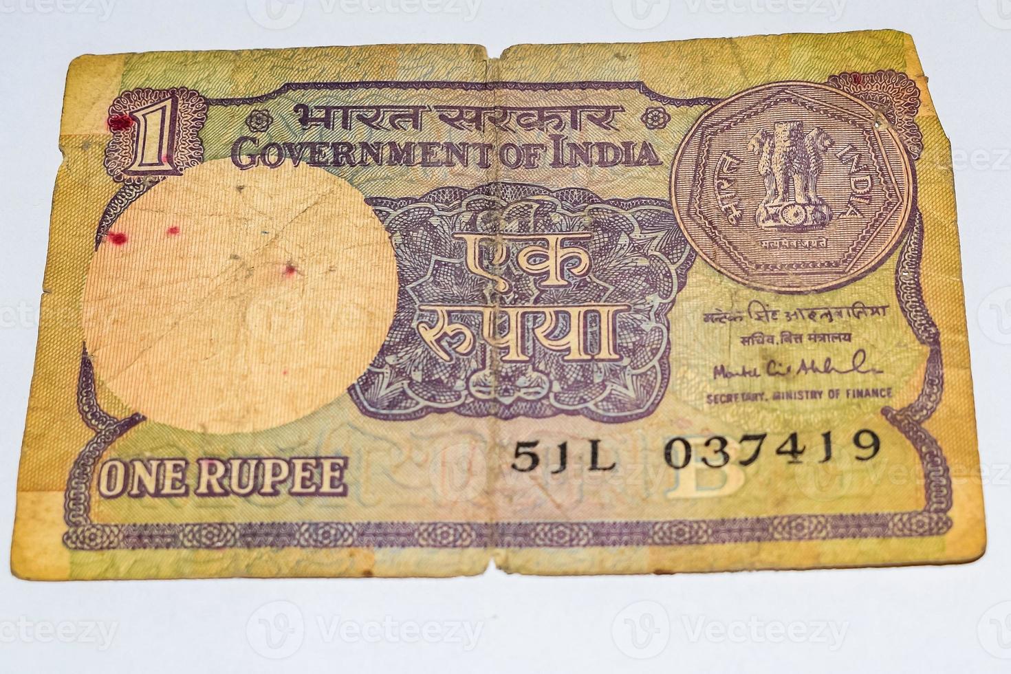 Rare Old Indian One rupee currency note on white background, Government of India one rupee old banknote Indian currency, Old Indian Currency note on the table photo