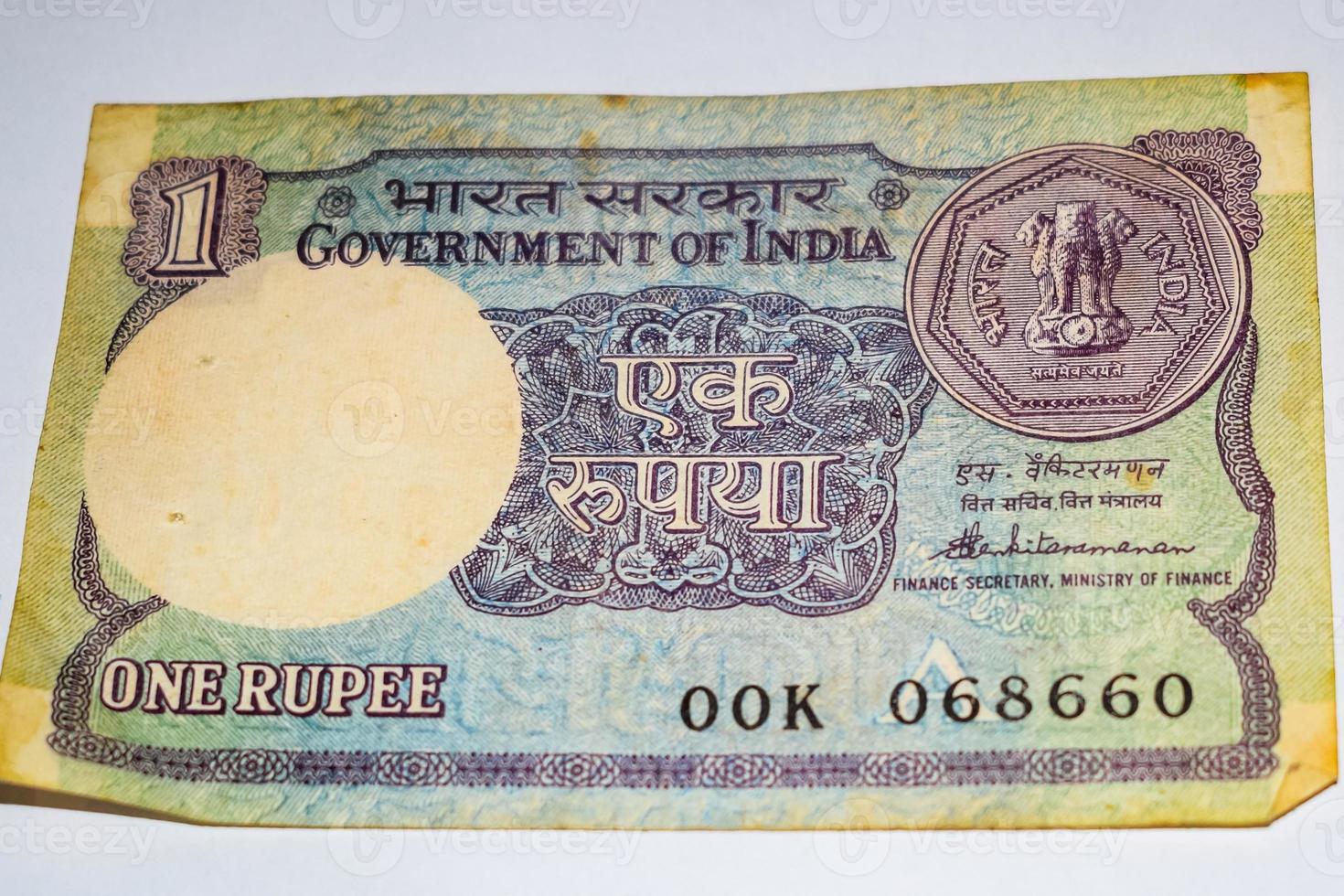 Rare Old Indian One rupee currency note on white background, Government of India one rupee old banknote Indian currency, Old Indian Currency note on the table photo