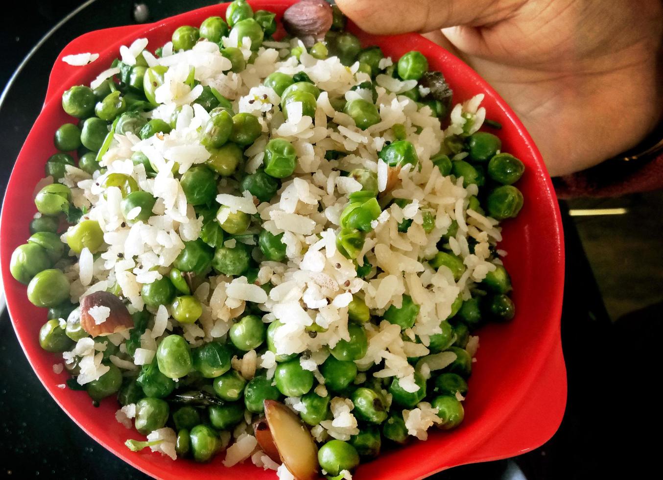 Indian Breakfast Dish Poha Also Know as Pohe or Aalu poha made up of Beaten Rice or Flattened Rice. photo