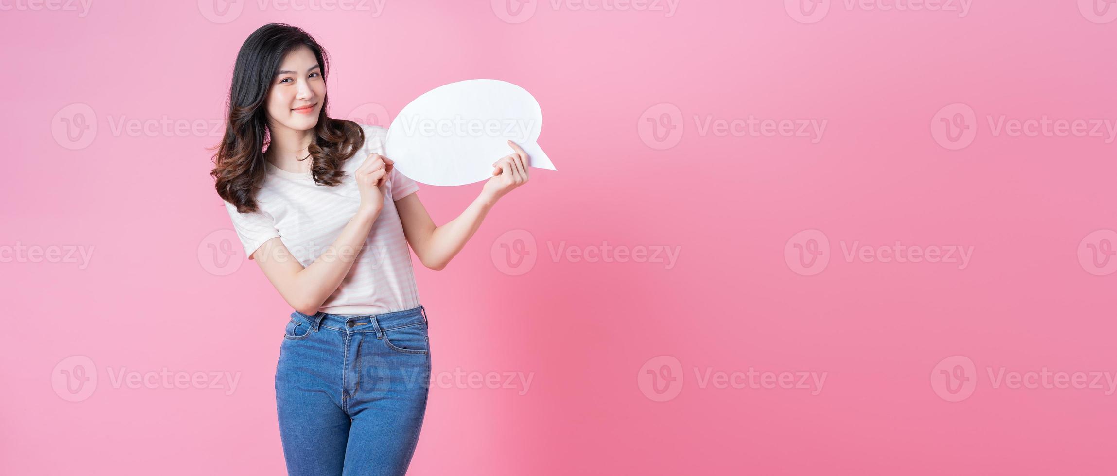 Image of young Asian woman holding message bubble on link background photo