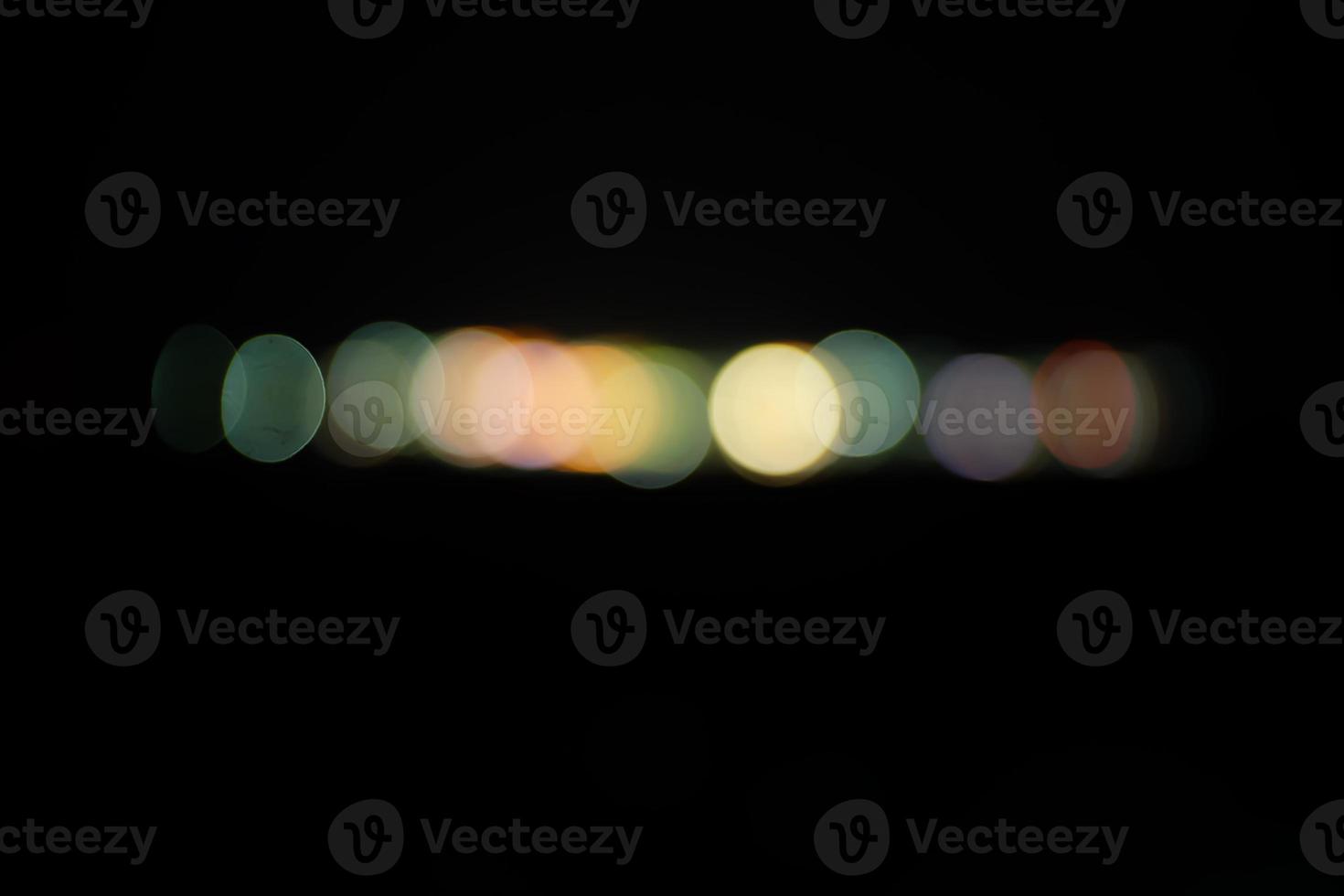 luz abstracta en el bokeh de la ciudad y luces desenfocadas, fondo borroso nocturno foto