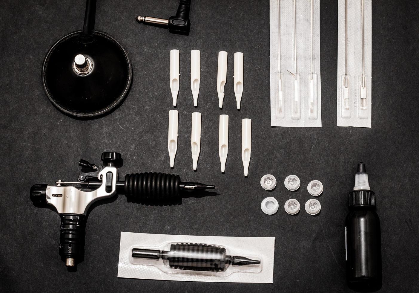 Accessories for tattoo, tattoo artist tools in salon photo